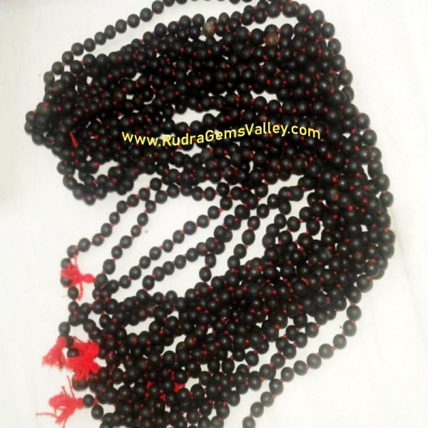 Black Vaijayanti Wood Beads-Seeds String (mala of 108 vaijayanti 6-7mm beads + 1 rudraksha 16mm beads), pack of 1 string.