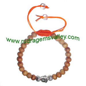 Adjustable beaded free size 7mm white sandalwood beads bracelets, made of 7mm white sandalwood 24 beads and 3 budhha metal beads in thread as per picture. Pack of 1 piece, also available in custom designs and sizes as per your instructions.